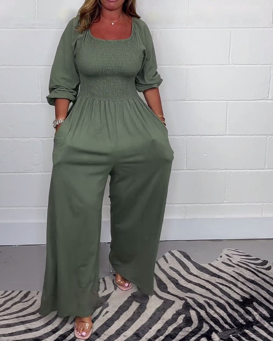 Ensfarvet jumpsuit med firkantet hals