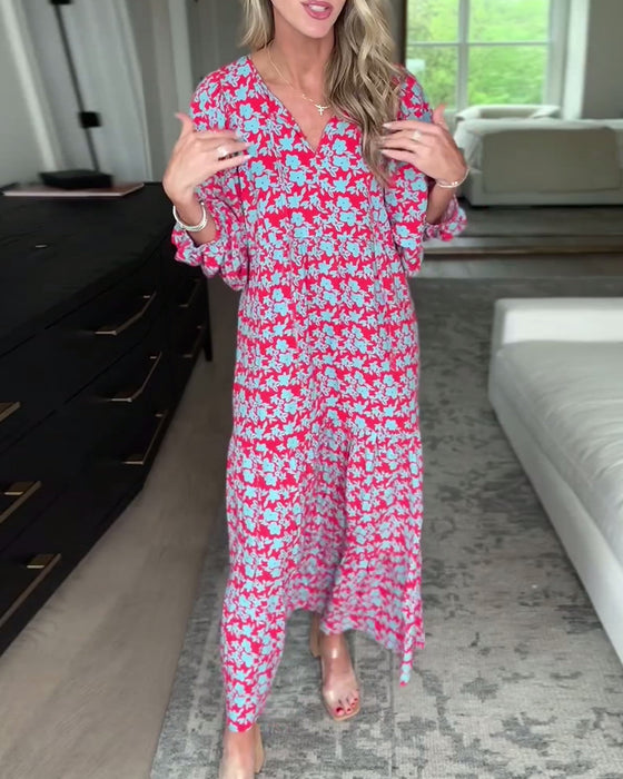 Lang blomsterkjole med V-hals og lanterneærmer