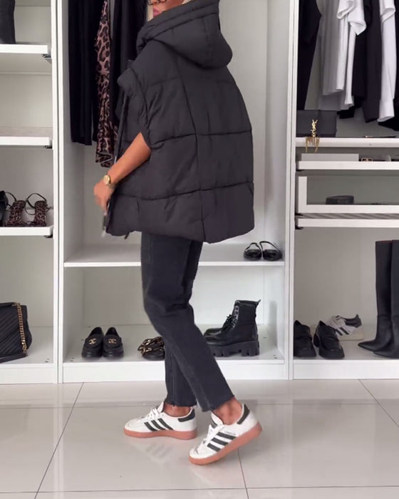 Vatteret vest med hætte og lynlås