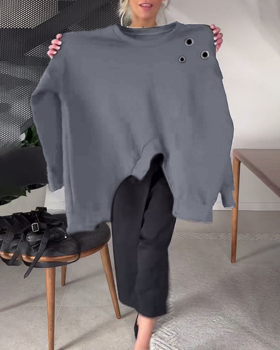 Sort sweater i løs pasform med slids