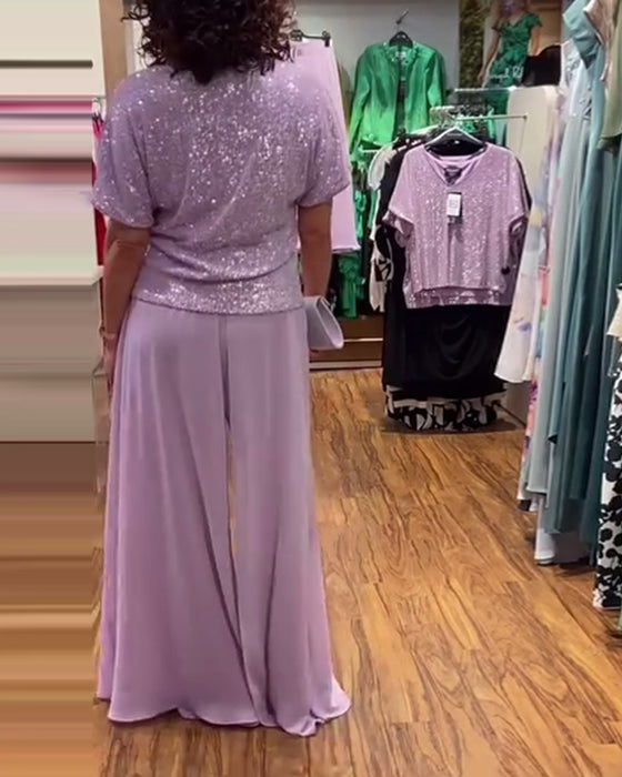 V-halset kortærmet bluse med pailletter