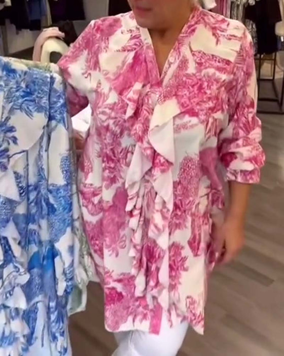 Afslappet bluse med flæser og print