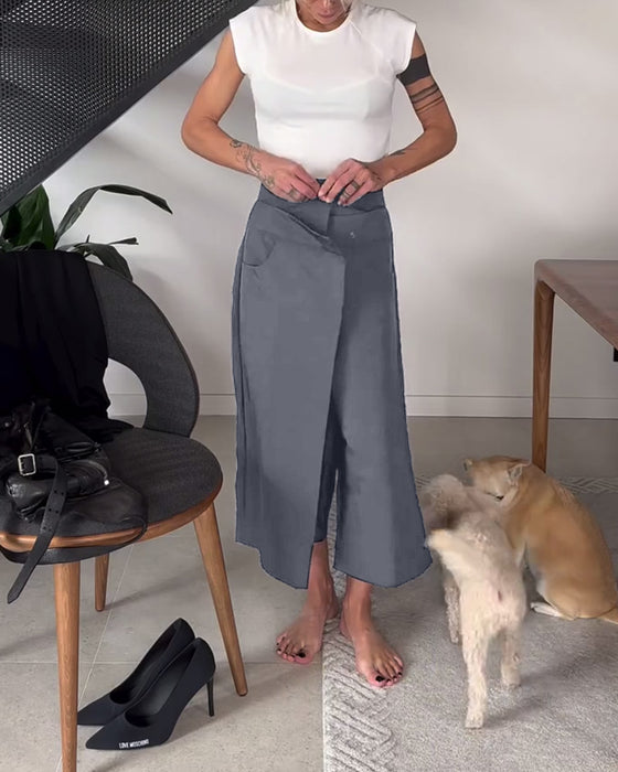 Højtaljede sorte bukser med tværgående lukning