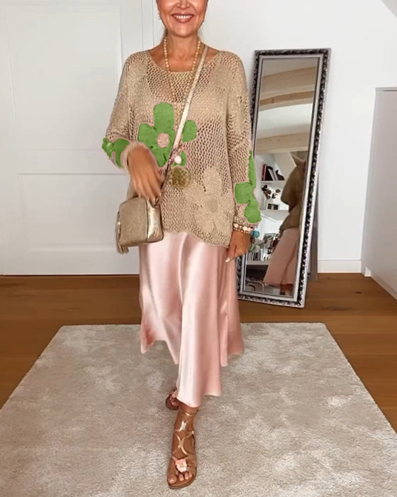 Hulmønstret sweater med blomstermotiver