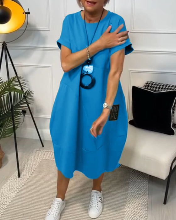 Sort kortærmet kjole med 'HOPE' motiv