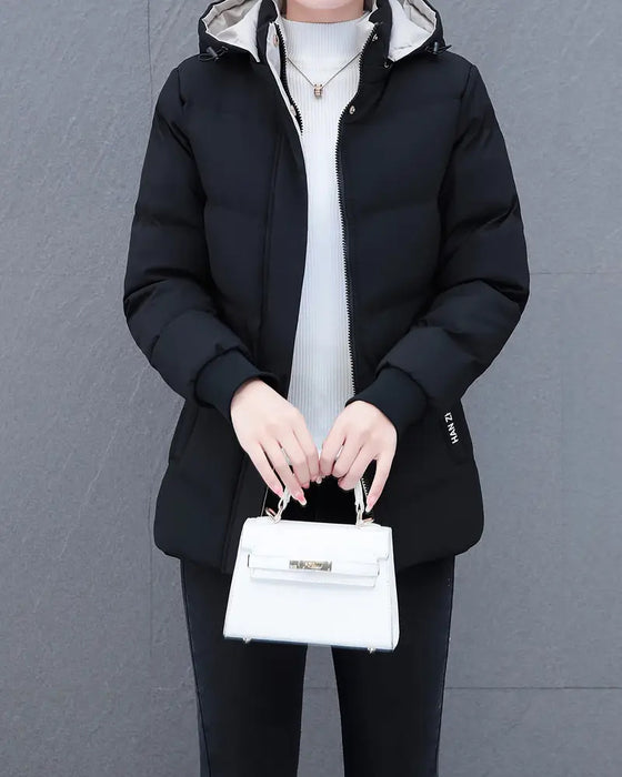 Jakke med afslappet, ensfarvet, varm hætte