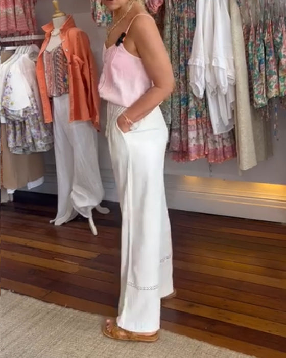 Hvide behagelige bredbenede bukser med lommer