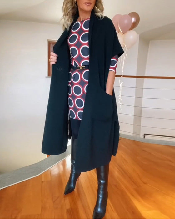 Lang sort cardigan med lommer og halve ærmer