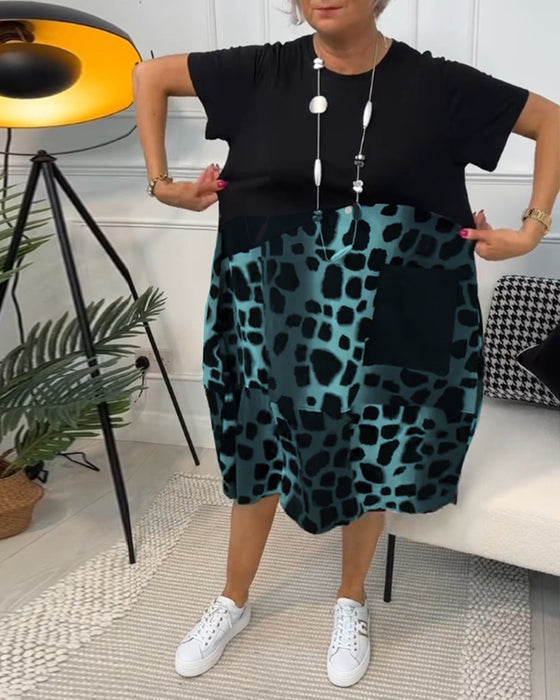 Sort patchwork kjole med rund halsudskæring