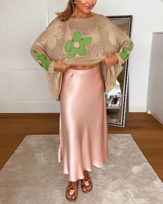 Hulmønstret sweater med blomstermotiver