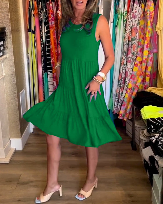 Blå ærmeløs kjole med plisseret nederdel