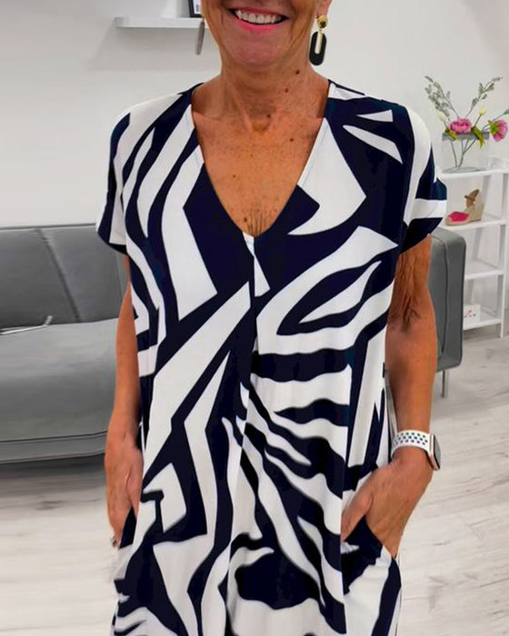 V-halset kortærmet kjole med print