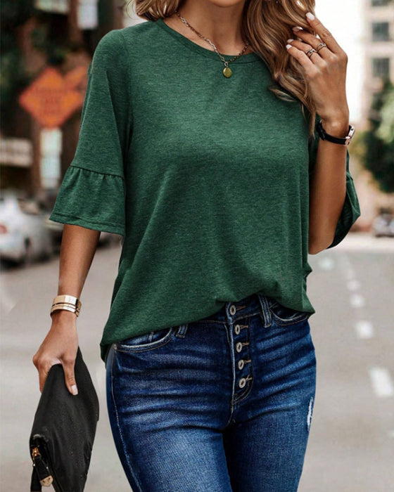 Grøn top med knapper bagpå