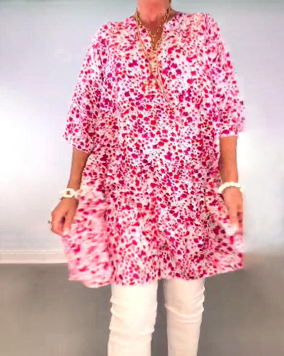 Lang blomsterbluse i løs pasform