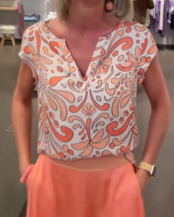 Afslappet bluse med V-udskæring og raglanærmer