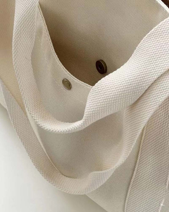 Kanvastaske med dobbelte hanke og stor kapacitet