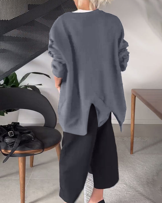 Sort sweater i løs pasform med slids