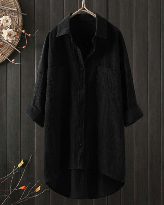 Ensfarvet løs bluse med lange ærmer