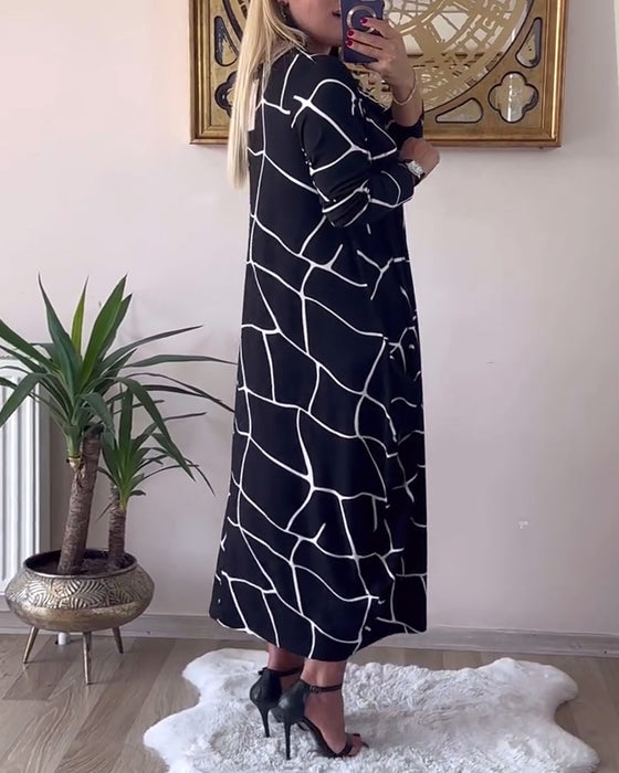 Kjole løs med rund hals og langærmet lomme