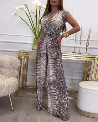 Mønstret jumpsuit uden ærmer med dyb V-udskæring