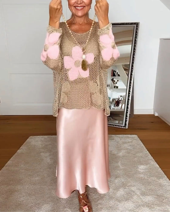 Hulmønstret sweater med blomstermotiver