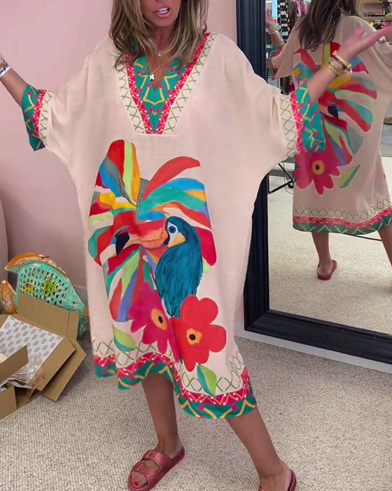 V-halset kjole med tropiske motiver