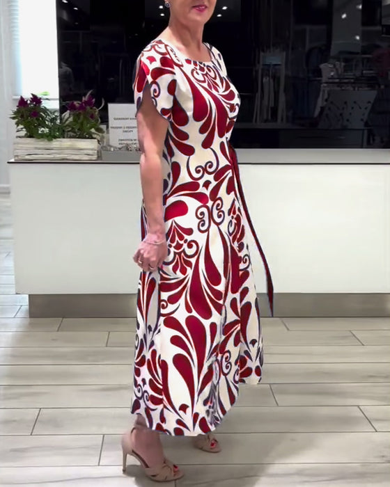 Elegant kortærmet kjole med print og taljebånd