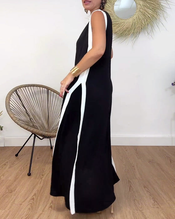Sort kjole uden ærmer med kontrasterende hvide kanter