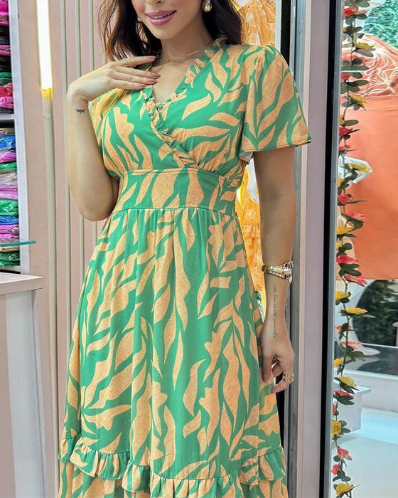 Elegant kjole med print og indsnævret talje