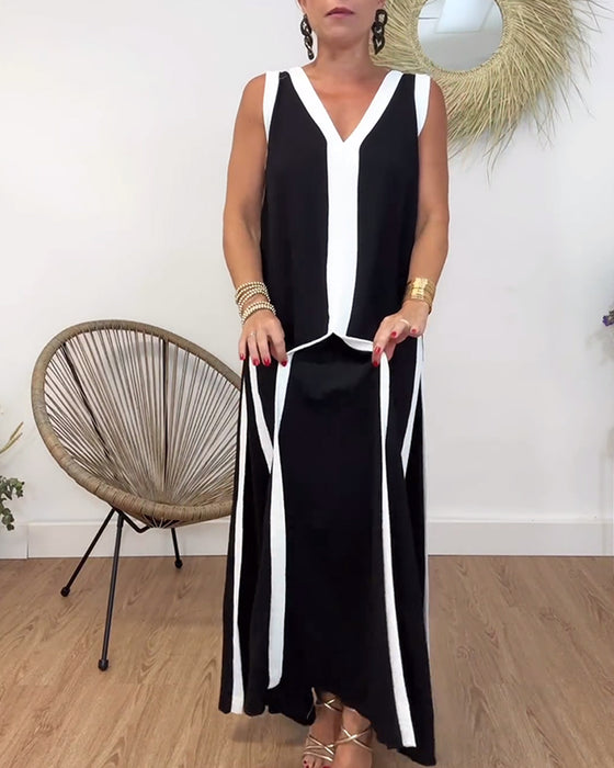 Sort kjole uden ærmer med kontrasterende hvide kanter