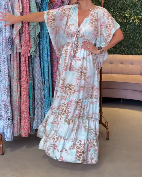 Lang kjole med print og sommerfugleærmer