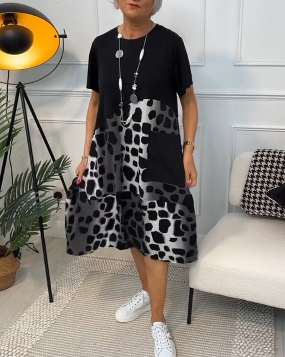 Sort patchwork kjole med rund halsudskæring