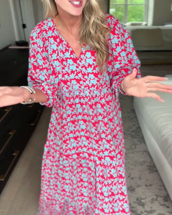 Lang blomsterkjole med V-hals og lanterneærmer