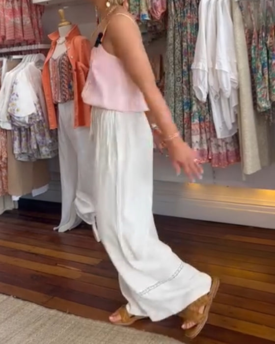 Hvide behagelige bredbenede bukser med lommer