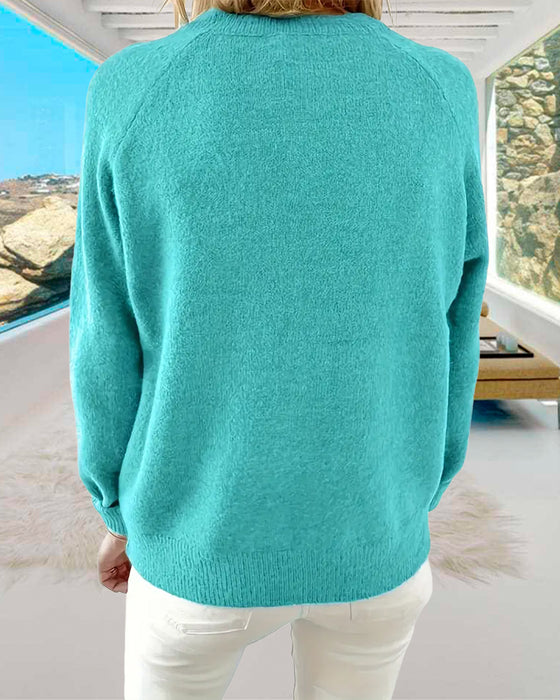 Frisk turkisfarvet sweater med henley-krave