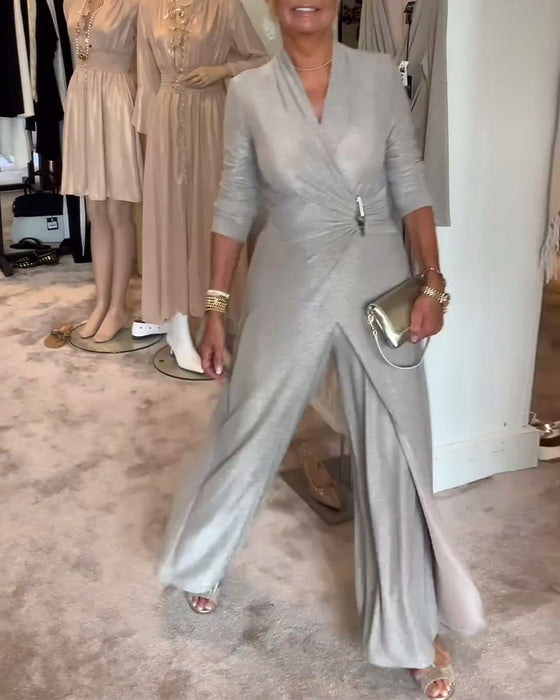 Elegant plisseret sølvfarvet jumpsuit