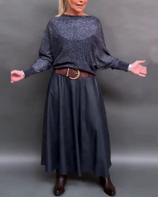 Skinnende top med rund hals og dolmanærmer