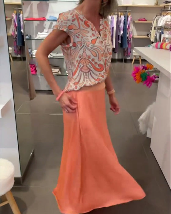 Afslappet bluse med V-udskæring og raglanærmer