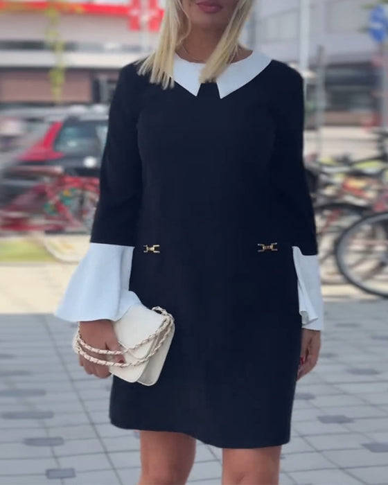 Elegant kjole med klokkeærmer og falsk lagdeling