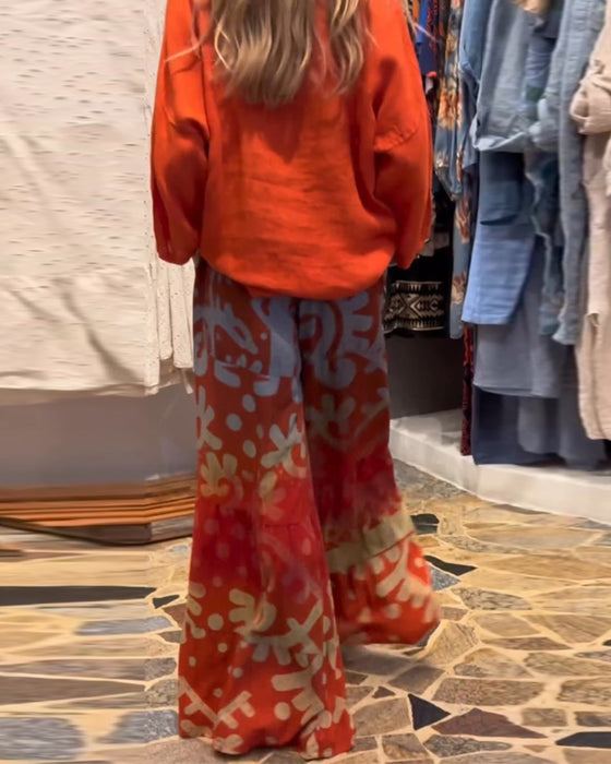 Bredbenede bukser i løs pasform med lommer og print