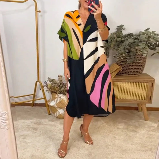 Afslappet kjole med farverigt bladmotiv