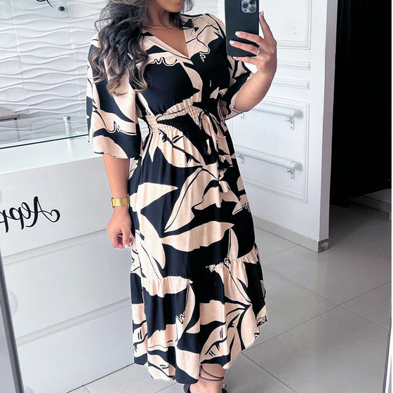 Elegant kjole med V-hals og taljebinding