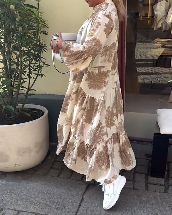 V-halset lyserød kjole med svaj og print