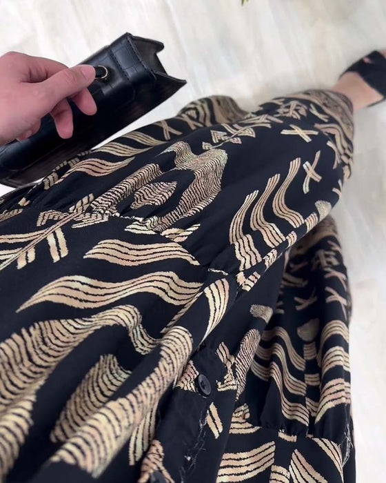 V-halset langærmet kjole med gyldent print