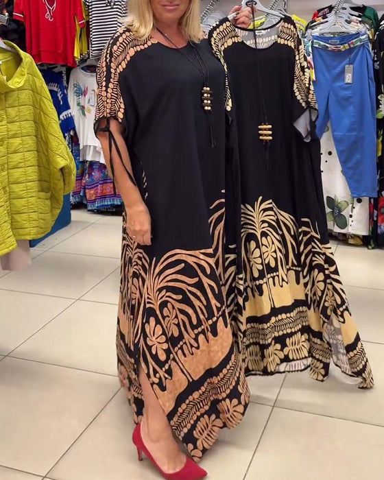 Kortærmet løs kjole med gyldent palmemotiv