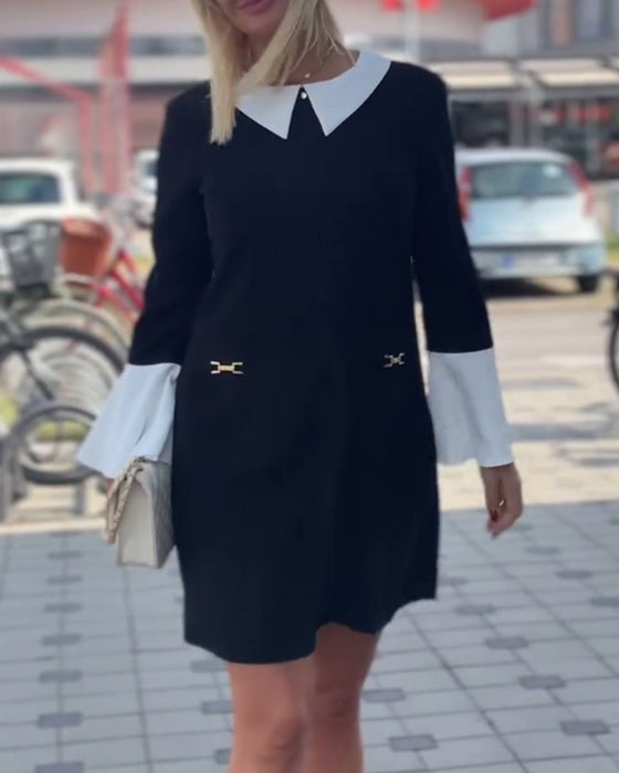 Elegant kjole med klokkeærmer og falsk lagdeling