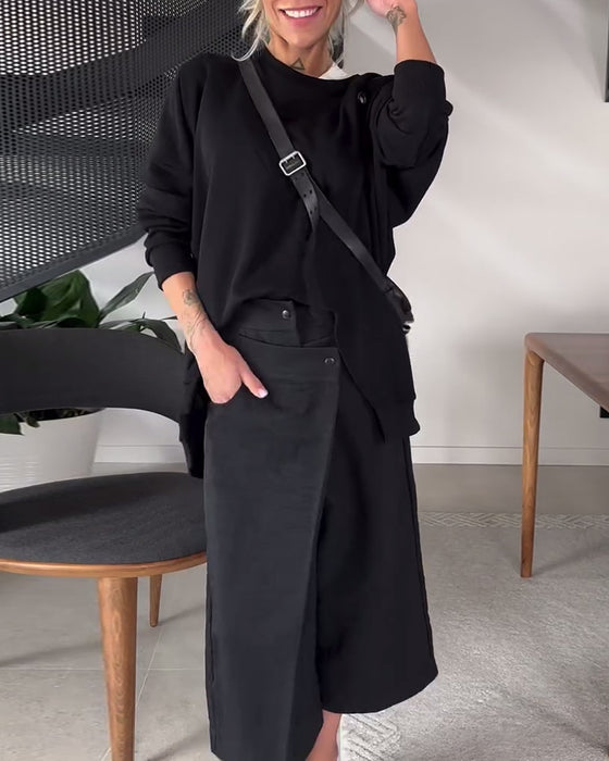 Sort sweater i løs pasform med slids