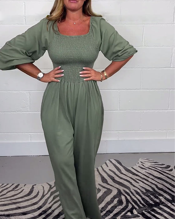 Ensfarvet jumpsuit med firkantet hals