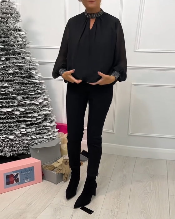 Stilfuld ensfarvet bluse med ståkrave