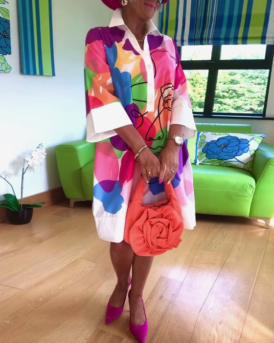 Farverig kjole med portrætmotiv